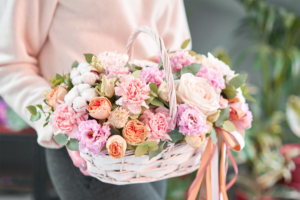Delivery Man holding a bouqet of flowers